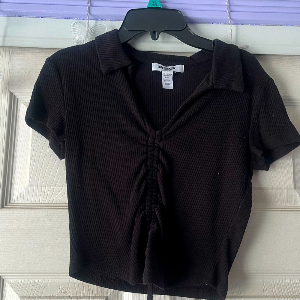 Black shirt with tie and string in front that adjust the cropness.